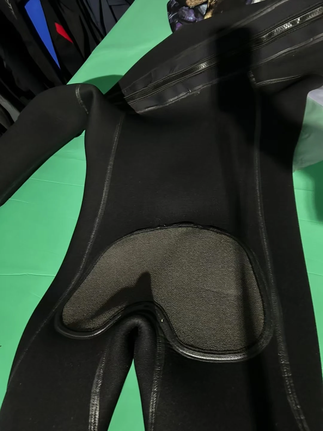 Black Smooth Finish Suit with Reinforced Panels, seat detail.