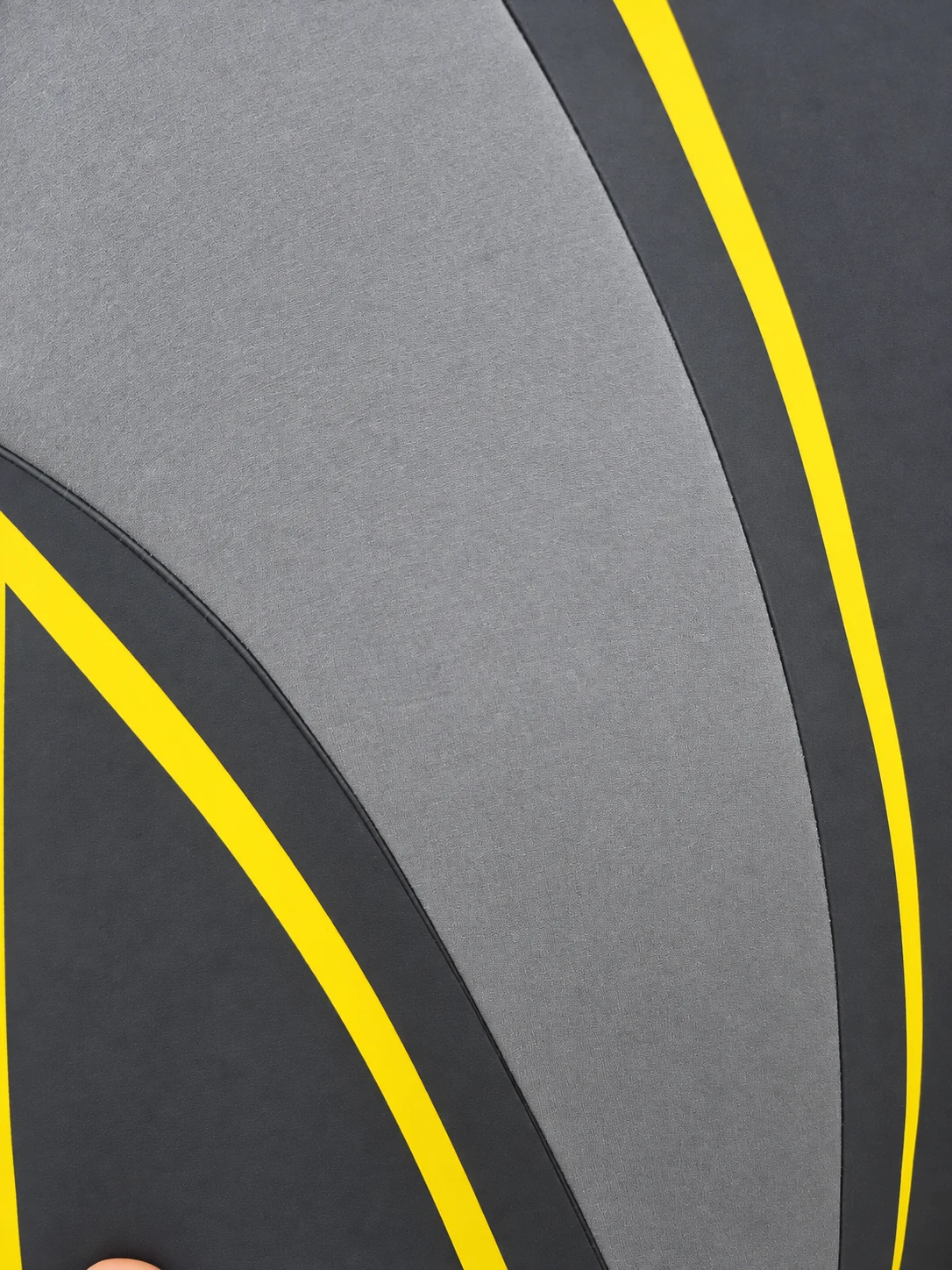 A gray side panel with yellow outline graphics. Detail of the INSEAKU yellow outline triathlon wetsuit.